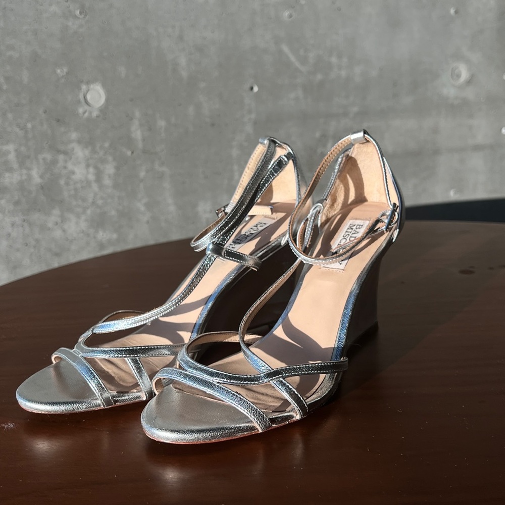 Badgley Mischka silver wedge heels.
